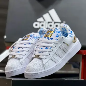 Zapatilla Adidas Superstar Blanco Azul y Dorado